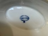 a white plate with a blue and white design on it