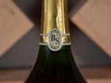 a close up of a bottle of wine on a table