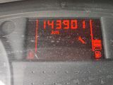 a digital clock on the dashboard of a car