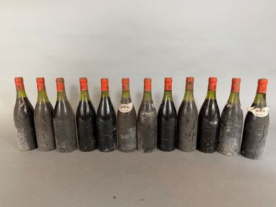 six bottles of wine lined up in a row on a table