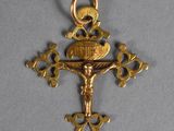 a close up of a cross with a jesus on it