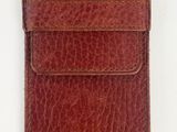 an image of a brown leather case on a white background