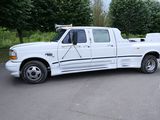 a white truck that is parked in the parking lot