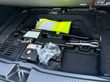 a trunk of a car with a bunch of items in it