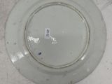 a white plate that has a blue and white label on it