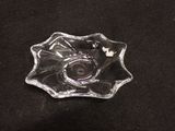 a glass bowl with a camera in it on a black surface