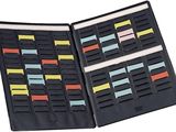a black folder with a lot of sticky notes in it
