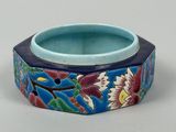 an image of a close up of a blue bowl with flowers on it