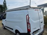 a white van that is parked on the side of the road