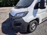 a white van that is parked on the side of the road