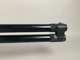 a close up of a pair of tripod legs on a white surface