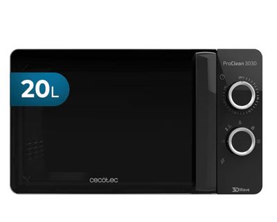 un four à micro-ondes noir posé sur un comptoir blanc