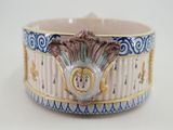 a close up of a bowl on a table with a white background