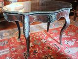 a small table with a glass top on a rug