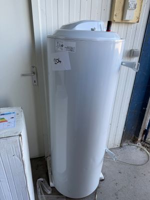 a white water heater sitting next to a white refrigerator