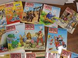 many children ' s books that are on the table