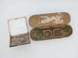 a small wooden box with a pair of eyeglasses in it