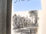 une photo d'un livre sur lequel figure l'image d'une maison