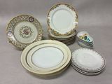 many plates and bowls sitting on a table