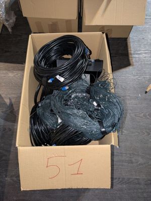 a cardboard box with a bunch of wires in it