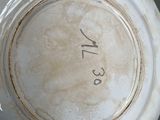 a close up of a white bowl with numbers on it