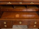 a wooden desk with a drawer on top of it