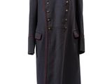 a black coat with red trims and a bow tie on a mannequin mannequin mannequin mannequin mannequin mannequin mann