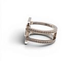 a close up of a silver ring on a white surface