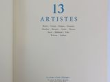 an open book with the title 13 artists written in blue on it