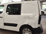 a white van that is parked in a garage