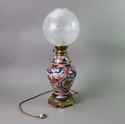 a lamp that is sitting on a table with a light on it