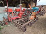 many different types of machinery that are parked in a barn