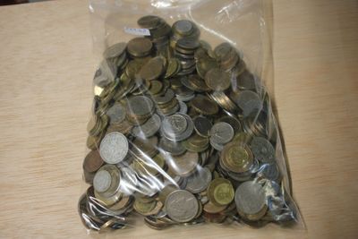 a bag full of coins sitting on a table