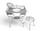 a small table with a bowl on it and a chair