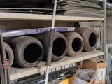 many pipes that are on the shelves in the garage