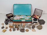 a suitcase full of rocks and stones on a table