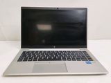 an open laptop computer sitting on top of a white table
