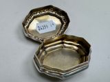 two silverplated octagonal trays with a price tag on them