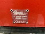 a close up of a sign on the back of a red car