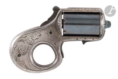 a close up of a silver revolver with a black handle