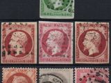 a close up of a group of stamps on a black surface