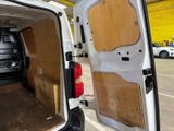 a white van with a wooden door open in a parking lot