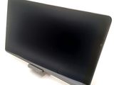 a tablet computer sitting on a stand on a white surface