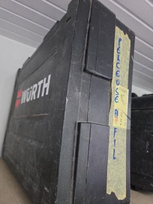 a black box that is sitting on top of a shelf
