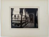 black and white photograph of a hallway in an old building