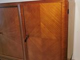a wooden cabinet that is sitting on a hard wood floor