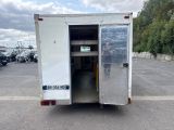 an image of a truck with its door open in a parking lot