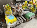 many bags of garbage sitting on a pallet