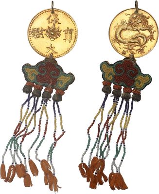 two pairs of earrings with a gold coin and tassels on them