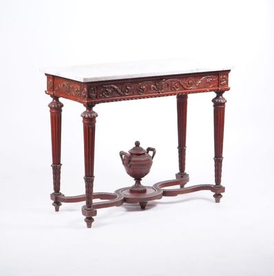 une petite table sur laquelle est posé un vase